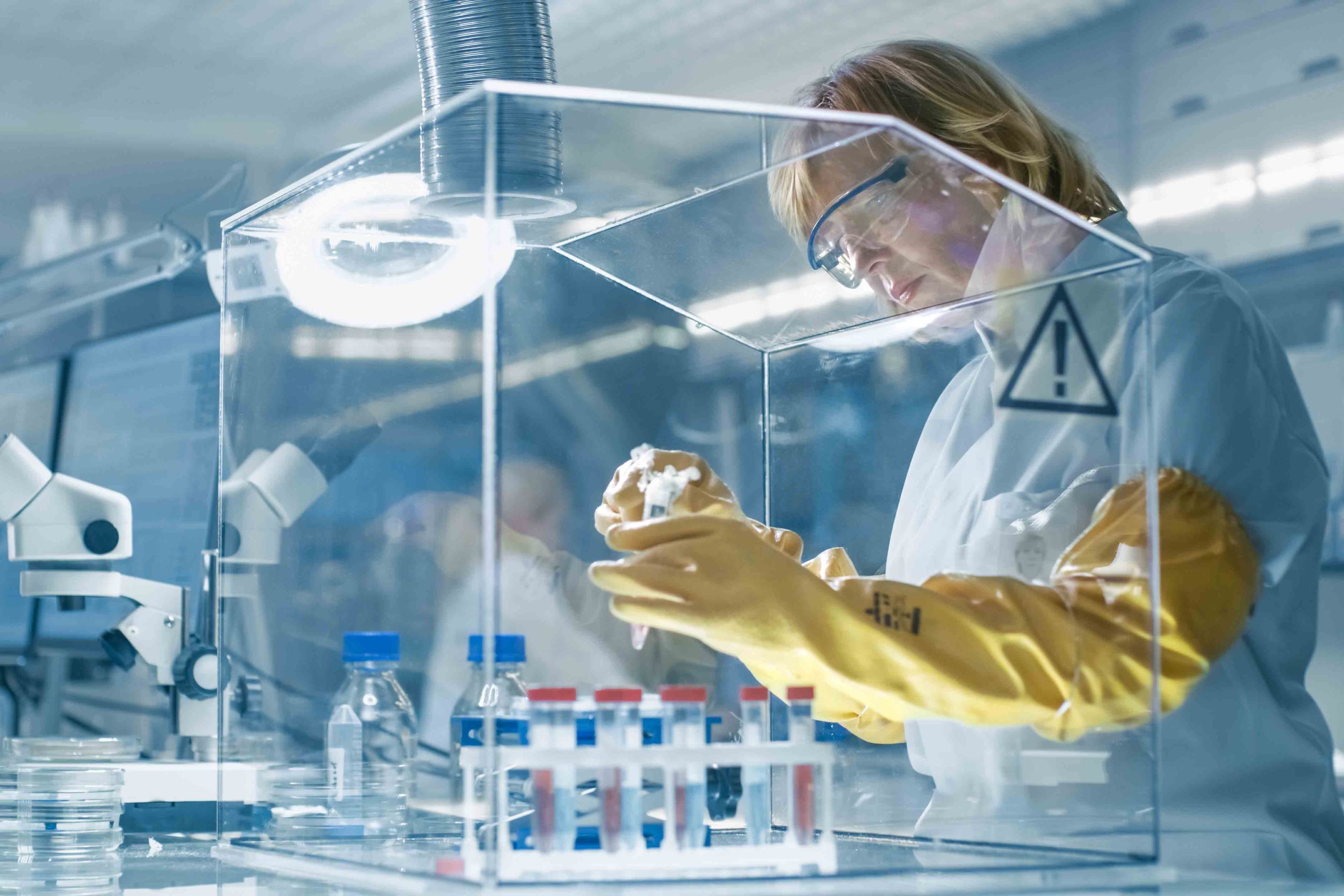 High-clarity custom acrylic laboratory isolator shield providing a sterile environment for pharmaceutical research and sample preparation.